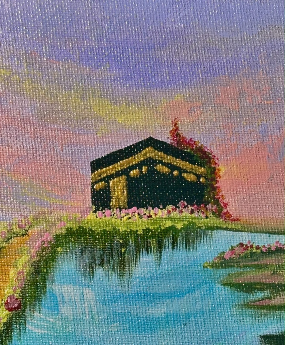 Close detail of the painted Kaaba in gold on a green islet, reflected in turquoise water