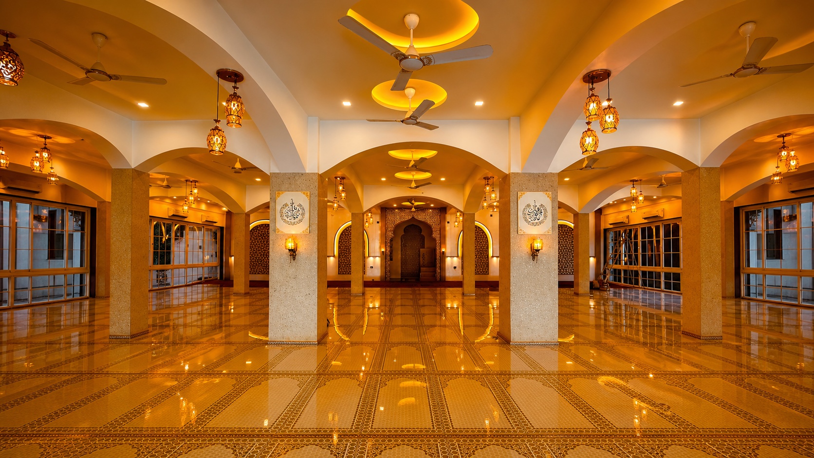 Two Jabin Arts paintings installed between luminous arches inside a mosque prayer hall
