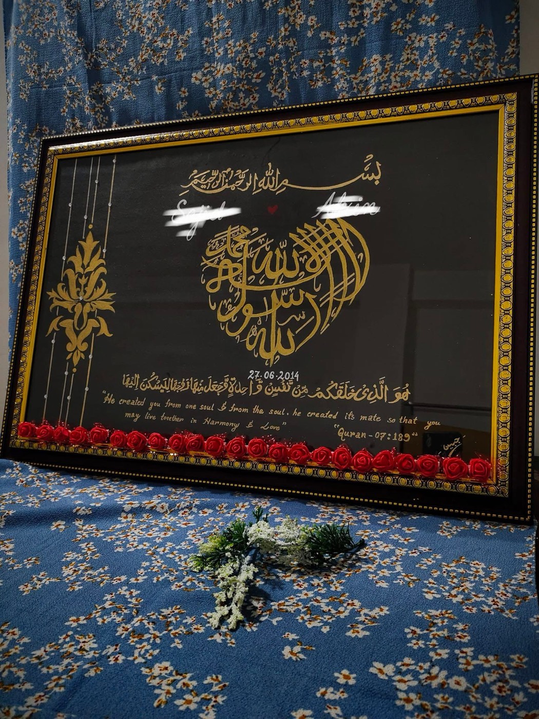 Gold calligraphy shaped as a heart with names and a date, black wedding commission piece